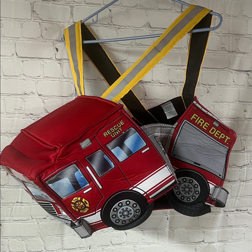 Red Fire Truck Costume with fireman’s helmet. wear over shoulder LIGHTS UP